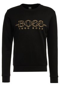 Felpa nera a maniche lunghe con girocollo, decorata con il logo dorato "BOSS HUGO BOSS" ricamato sul petto.