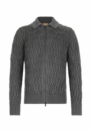 Grå stickad kofta med diamantmönster, dragkedja och krage. Tillverkad av texturerat tyg med ribbade mudd och fåll.