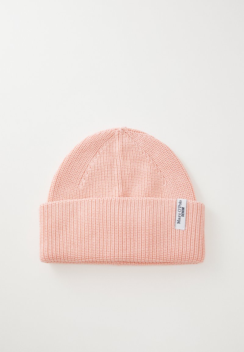 Light pink knitted beanie with folded cuff and white rectangular label reading "Marc O'Polo DENIM" on a white background.