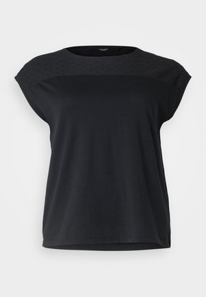 Melnā īsām piedurknēm augšdaļa ar strukturētu, paraugu yoku un brīvu piegriezumu. Gluda kokvilnas auduma ar noapaļotu kakla izmēru un taisnu zemu.