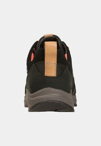 Black suede and mesh sneaker with a brown heel tab, orange accents, and a textured rubber sole. Rear view showcases the shoe's shape and detail.