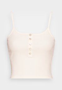 Haut court côtelé beige clair avec fines bretelles et une patte à cinq boutons à l'avant. Texture douce avec une coupe ajustée.