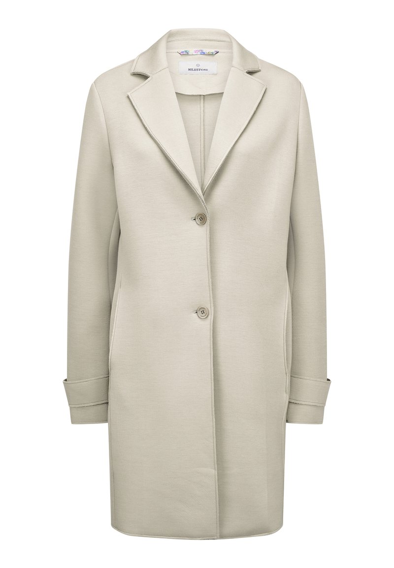 Hellbeige, langer Mantel aus strukturiertem Stoff mit Reverskragen, zwei Knöpfen und seitlichen Taschen. Einfaches und klares Design.