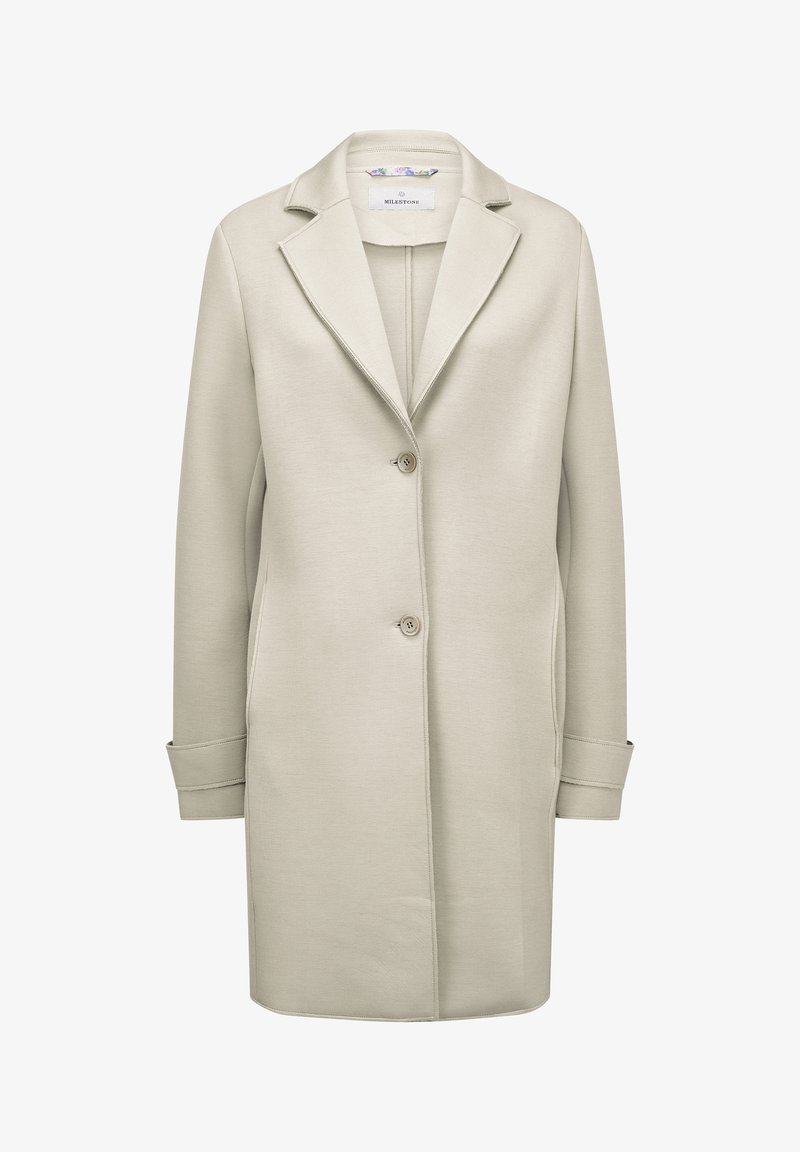 Hellbeige, langer Mantel aus strukturiertem Stoff mit Reverskragen, zwei Knöpfen und seitlichen Taschen. Einfaches und klares Design.
