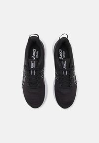 Black athletic shoes with a breathable mesh upper, white accents, and a textured sole. Features laces and an OrthoLite insole for comfort.