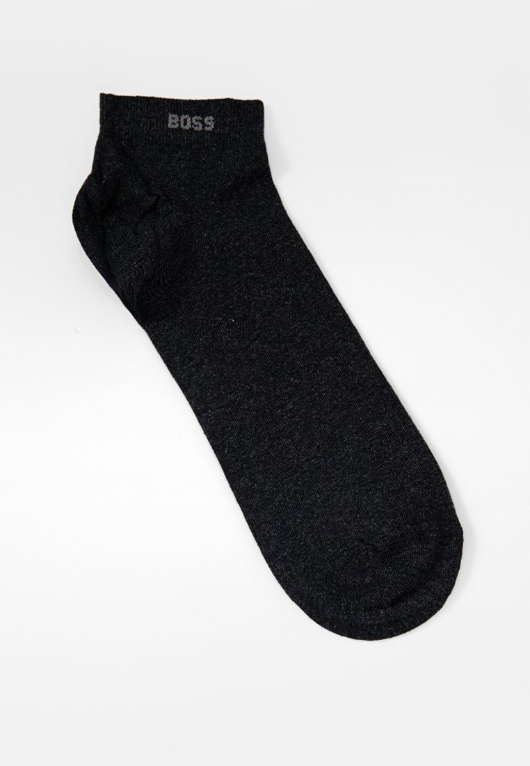 Schwarze Baumwollsocke mit nahtlosem Design, geprägtem Logo "BOSS" am Bund und glatter Textur. Ideal für den täglichen Gebrauch.