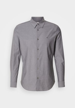 Szürke csíkos, hosszú ujjú pamut ing, gombos gallérral és logóval a bal mellen. Slim fit fazon.