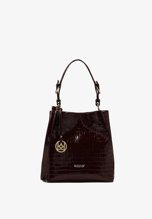 Dark burgundy crocodile-textured handbag with a glossy finish, featuring a single handle and a gold-tone logo charm.