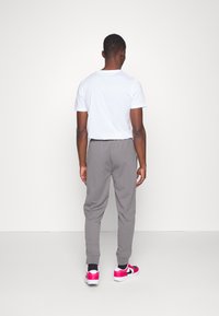 Sergio Tacchini NEW DAMARINDO  - Treniņtērpa apakšdaļas - charcoal grey/black