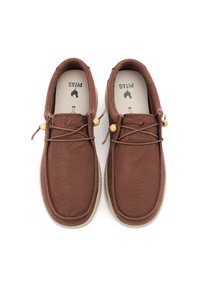 Brown canvas shoes with a textured upper, elastic laces, and wooden bead accents. Rubber sole with a rounded toe and stitched detailing.