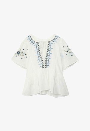 Bela kratka majica s kratkimi rokavi, modrimi in črnimi rožnatimi vezeninami, z vezi na izrezu okrog vratu in z volanom na spodnjem robu.