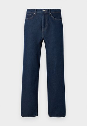 Jeans din denim de culoare albastru închis, cu croială dreaptă, cinci buzunare și cusături vizibile. Dispune de o închidere cu nasture și curea de suspensie.