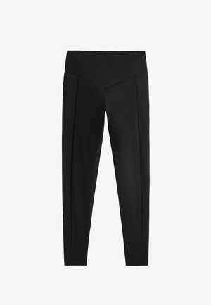 Schwarze Leggings mit hohem Bund, die über eine glatte Textur und maßgeschneiderte Falten an den Seiten verfügen. Der Schnitt ist eng an den Beinen.