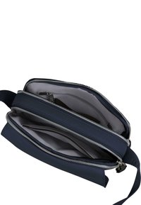 Borsa a tracolla navy con cerniere e più scomparti. Materiale esterno liscio, foderatura grigia e tracolla regolabile.