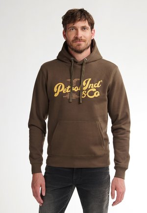 Brown hooded sweatshirt with a kangaroo pocket, featuring yellow printed logo text and adjustable drawstring. Soft cotton blend material.