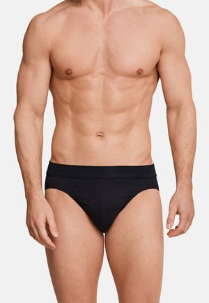 Schwarz gestreifte Herrenunterwäsche mit einem glatten elastischen Bund. Der Stoff wirkt weich mit einem taillierten Design, das die Taille und die Beine betont.