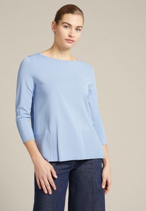 - Sweter