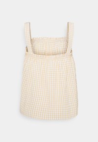 Żółta i biała bluzka w kratkę z regulowanymi ramiączkami, marszczonym gorsem i prostym dołem. Wykonana z lekkiej bawełny.