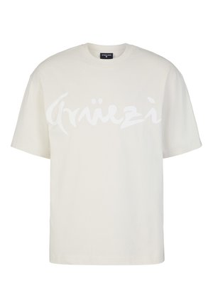 T-shirt in cotone color crema con maniche corte e vestibilità ampia. Presenta un design grafico bianco prominente sul petto.