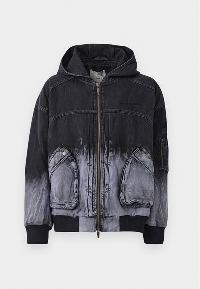 Black denim jacket with an ombre effect transitioning to gray. Features a front zip closure, two side pockets, and ribbed cuffs.
