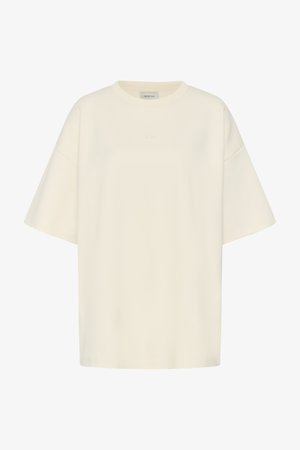 T-shirt oversize crème à manches courtes avec col rond et détail subtil du logo à l’avant.