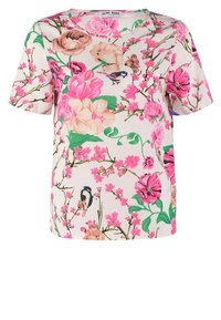 Bluzka z krótkim rękawem w kwiaty z kremowym tłem, różowymi i zielonymi kwiatami oraz ptakami, o luźnym kroju. Wykonana z lekkiego materiału.