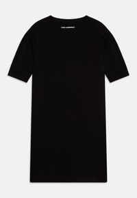 Vestido preto de manga curta feito de algodão com um corte descontraído. Apresenta pregas subtis nas mangas e o logotipo "KARL LAGERFELD" nas costas.