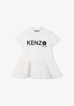 Robe en coton blanc à manches courtes, ourlet évasé, avec imprimé texte noir "KENZO PARIS" agrémenté d'un motif fleur. Fermeture pressionnée à l'épaule.