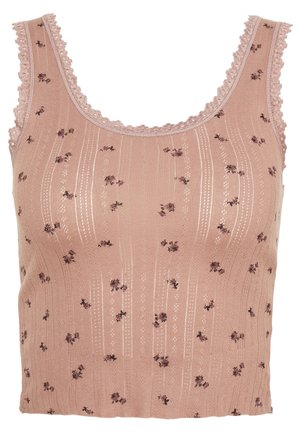 Top court en tricot rose sans manches avec petit imprimé floral, rayures verticales en œillets et bordure en dentelle festonnée le long de l'encolure et des emmanchures.