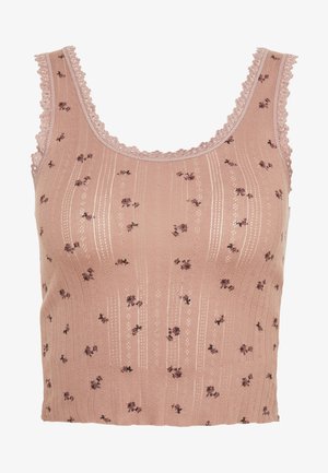 Top court en tricot rose sans manches avec petit imprimé floral, rayures verticales en œillets et bordure en dentelle festonnée le long de l'encolure et des emmanchures.