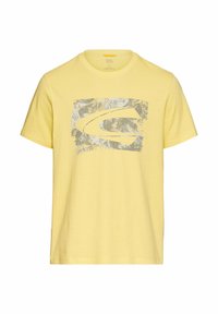 Gul bomulds T-shirt med rund hals, korteærmer og et tekstureret gråt grafisk design med et stiliseret logo på fronten.