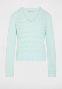 Un maglione verde menta chiaro con scollo a V, maniche lunghe e un motivo a zigzag testurizzato. Realizzato in materiale morbido e leggero.