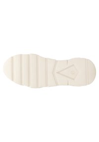 Suola di una sneaker, realizzata in gomma di colore chiaro, con una superficie testurizzata con scanalature e un ritaglio geometrico al centro.