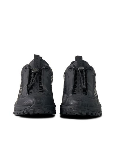 Pair of black rugged sneakers with fast lacing system and textured toe caps, viewed from the front on a white background.