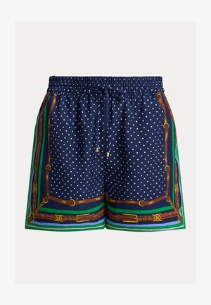 Laivastonsiniset shortsit, joissa valkoiset pilkut, joustava vyötärönauha, nyöri ja kuviollinen reunus, jossa on ruskeita vöitä ja vihreitä yksityiskohtia.