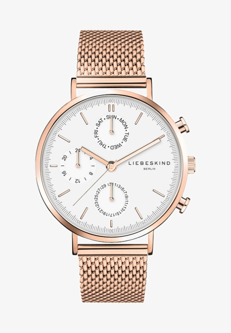 Runder Zeitmesser mit weißem Zifferblatt, rosegoldenem Metallmesh-Armband, drei Zusatzanzeigen für Datum und Wochentag sowie minimalistischen Stundenmarkierungen.