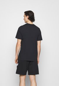 adidas Originals ESSENTIAL TEE UNISEX - T-shirt basic - black