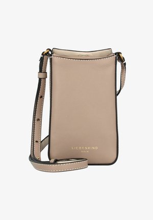 Beżowa skórzana torebka na ramię z regulowanym paskiem, czarnymi krawędziami i złotym logo "Liebeskind Berlin" z przodu.