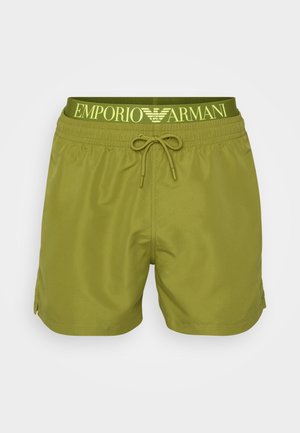 Green swim shorts made of lightweight material, featuring a drawstring waistband with "Emporio Armani" logo in yellow. No pockets visible.