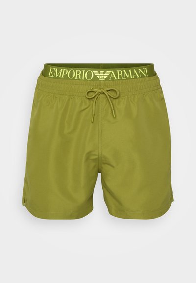 Žalios maudymosi šortai, pagaminti iš lengvo audinio, su raištelio juosmeniu ir geltonu "Emporio Armani" logotipu. Kišenių nematyti.