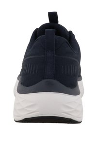 Navy athletic shoe with a textured mesh upper, white midsole, black outsole, and a rear pull tab for easy on/off.