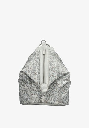 Sac à dos blanc avec motif floral argenté, fermeture éclair verticale centrale, deux poches latérales zippées et un anneau en métal en haut pour l'accrocher.