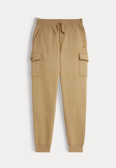 Beige bomulls joggers med elastisk midje, snøring og to side cargo lommer. Ribbestrikkede mansjetter og brodert logo på hoften.