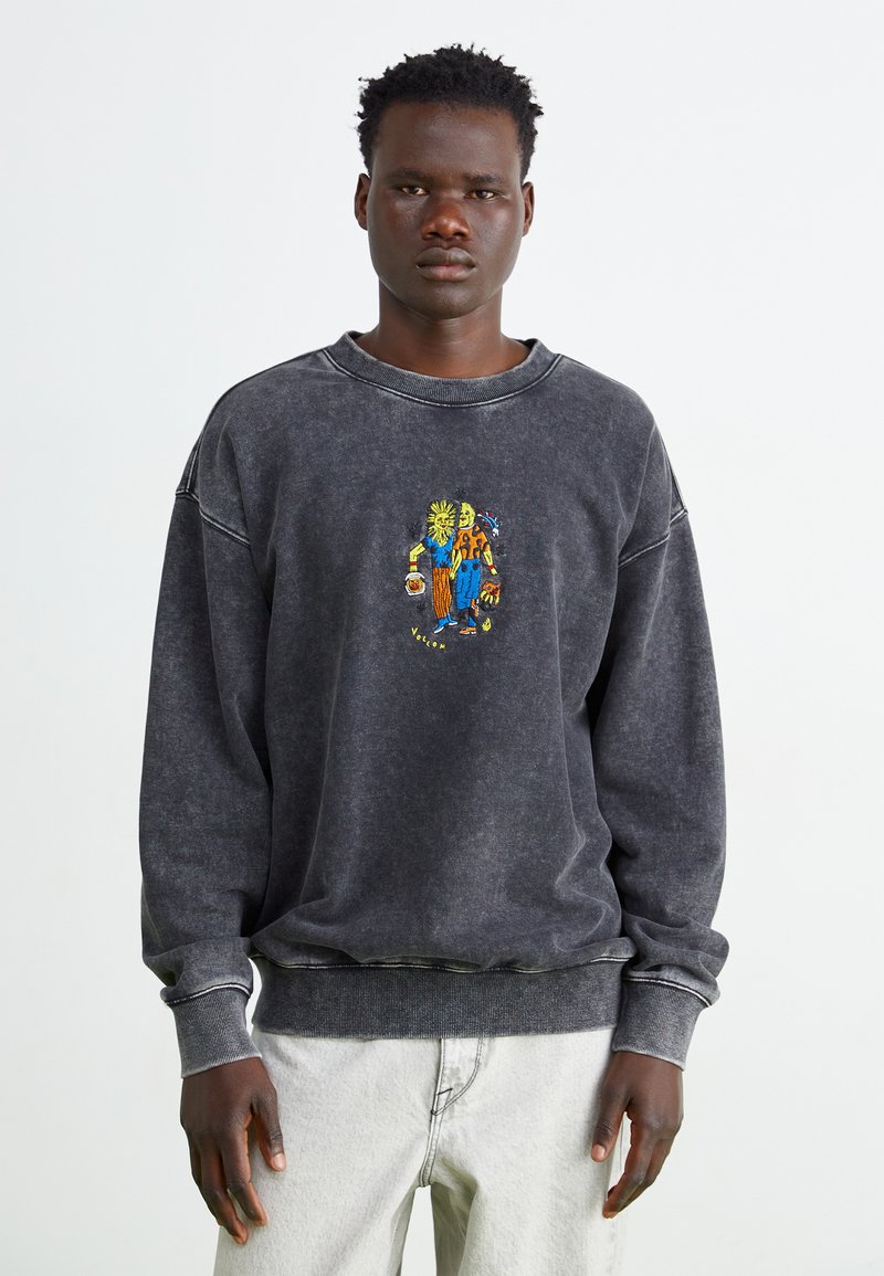 Donkergrijze sweatshirt van zachte stof. Bevat een ronde hals, geribde boorden en kleurrijke cartoonborduursels aan de voorkant.