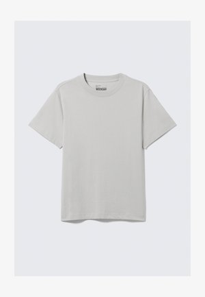 Ανοιχτό γκρι βαμβακερό T-shirt με στρογγυλή λαιμόκοψη και κοντά μανίκια, με μινιμαλιστικό σχέδιο και άνετη εφαρμογή. Χωρίς μοτίβα ή διακοσμητικά.
