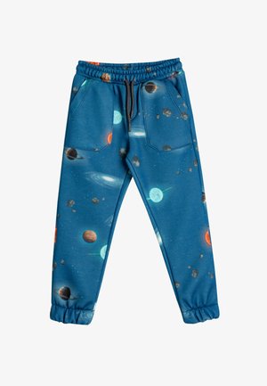 Blaue Sweatpants mit einem weltraumthemed Druck, der Planeten und Sterne zeigt. Elastischer Taillenbund, zwei Fronttaschen und elastische Bündchen an den Knöcheln.