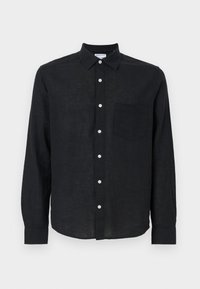 Sort linskjorte med knaplukning ved kraven. Har lange ærmer, knaplukning foran og en venstre brystlomme. Tekstureret stof.