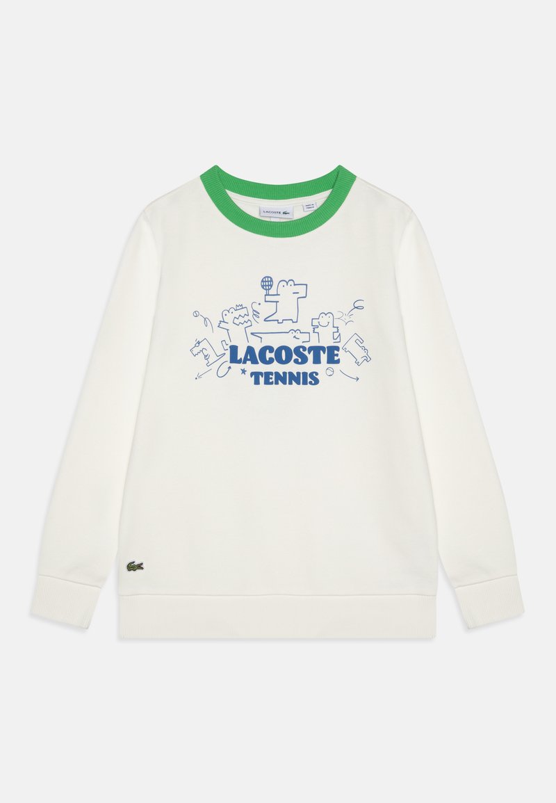 Sweatshirt blanc avec col ras du cou vert. Présente un graphique bleu avec "LACOSTE TENNIS" et des designs d'animaux ludiques. Logo Lacoste en bas.