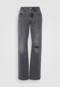 Grå denimjeans med lös passform, med en rivning vid knät, klassisk femfickdesign och kopparfärgade knappar. Distressed textur.