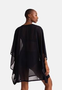 DORINA MOKOLO COVER UP - Rannatarvikud - black